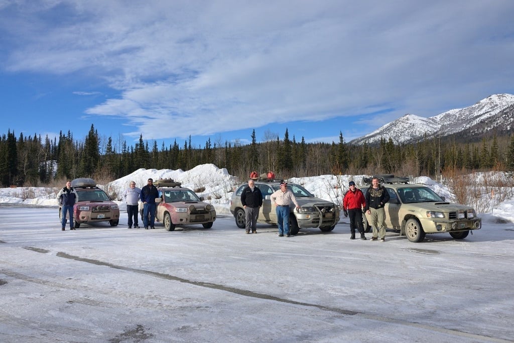 Teams posing at Denali National Park, but as usual, you can’t actually see the mountain hiding in the clouds.